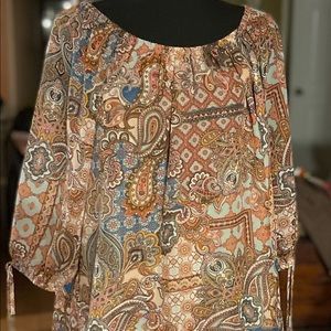 Mid length sleeves. Shirt is sheer material